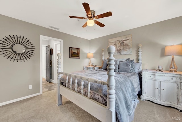 bedroom featuring light carpet and ceiling fan