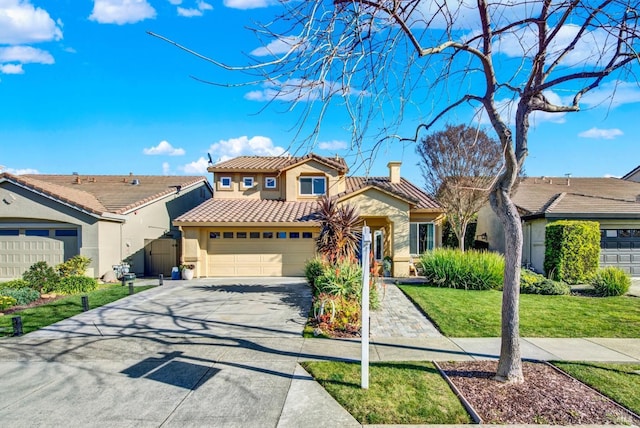 view of front of home featuring a garage and a front yard