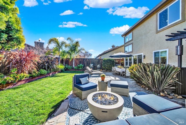 view of patio / terrace featuring an outdoor fire pit