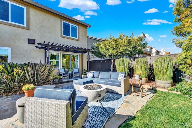 view of patio / terrace featuring a pergola and an outdoor living space with a fire pit