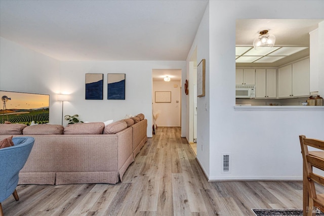 living room featuring light hardwood / wood-style flooring