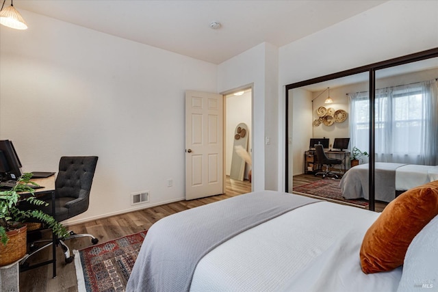 bedroom featuring a closet and hardwood / wood-style flooring