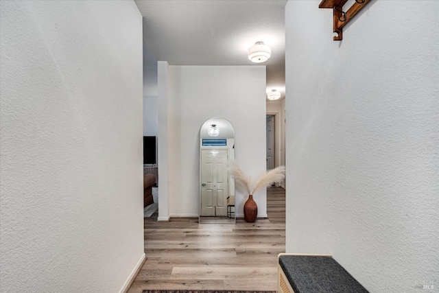 corridor featuring light hardwood / wood-style flooring