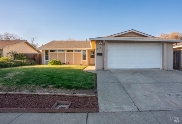 ranch-style house with a front lawn and a garage