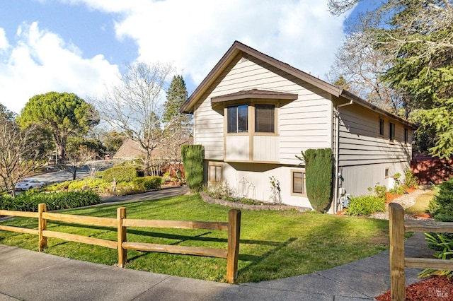 view of property exterior with a yard