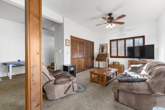 living room with ceiling fan and carpet flooring