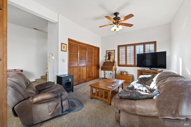 carpeted living room featuring ceiling fan