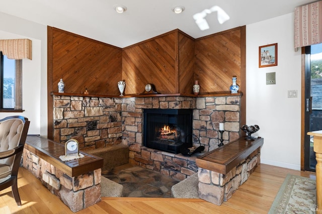 living room featuring light hardwood / wood-style flooring and a fireplace