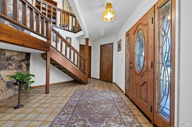 tiled entrance foyer with decorative columns