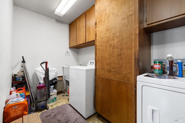 laundry area featuring cabinets and washer and dryer