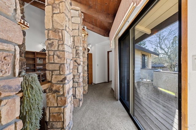 hallway with wooden ceiling, beam ceiling, high vaulted ceiling, and carpet