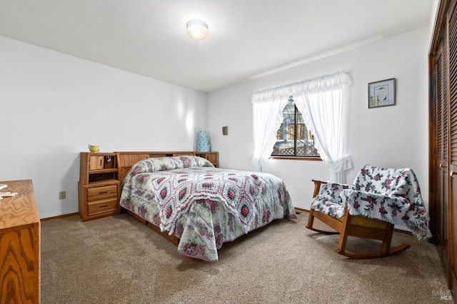 carpeted bedroom with a closet