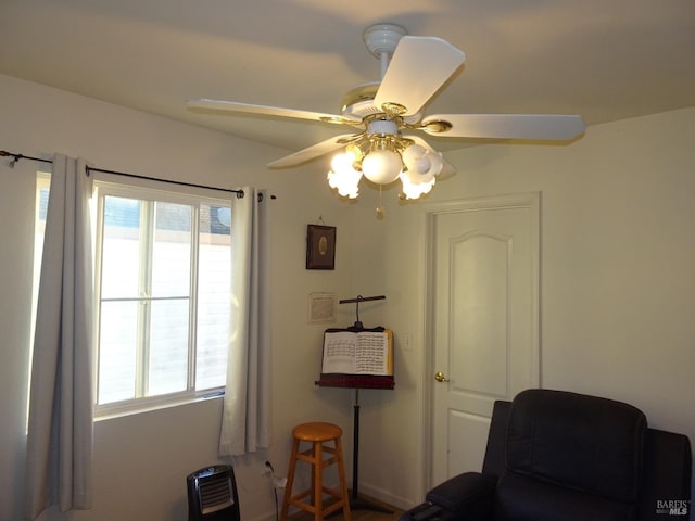 sitting room featuring plenty of natural light and ceiling fan