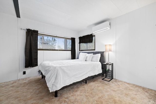 carpeted bedroom featuring a wall unit AC