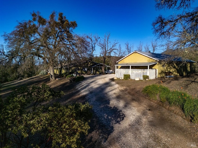 view of side of property featuring a porch