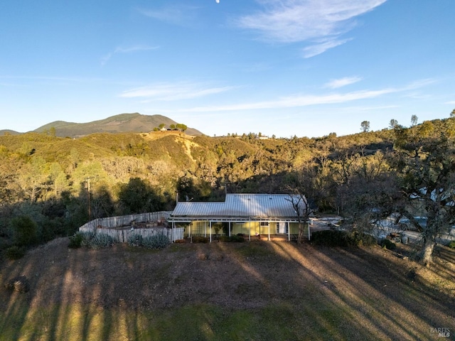 rear view of house featuring a mountain view