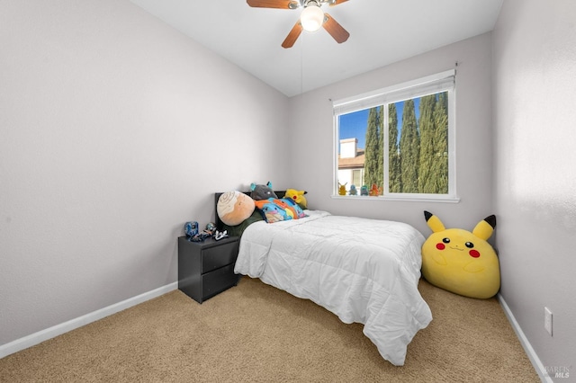 bedroom with light carpet, ceiling fan, baseboards, and lofted ceiling