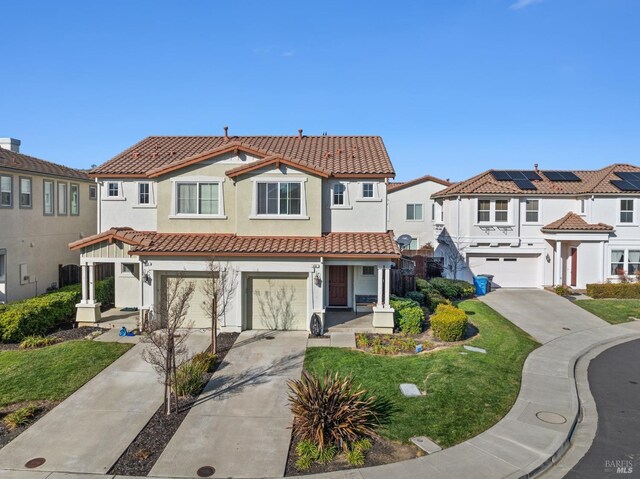 view of front facade with concrete driveway, a tile roof, and a residential view