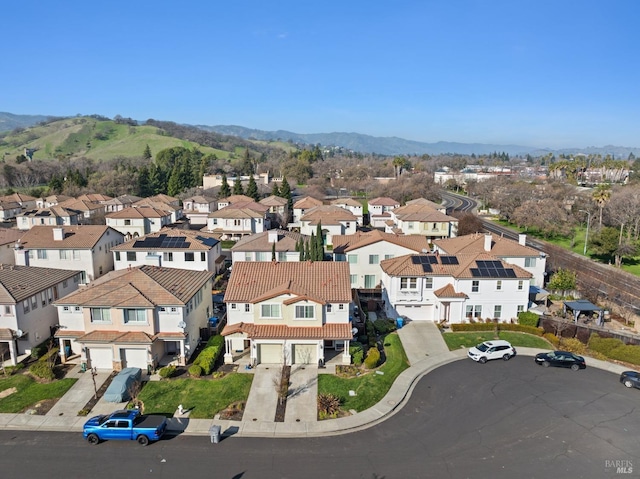 birds eye view of property with a residential view and a mountain view