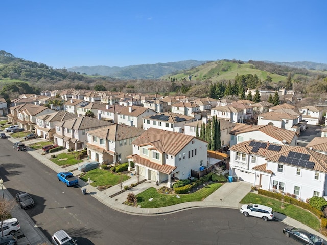 drone / aerial view featuring a mountain view and a residential view