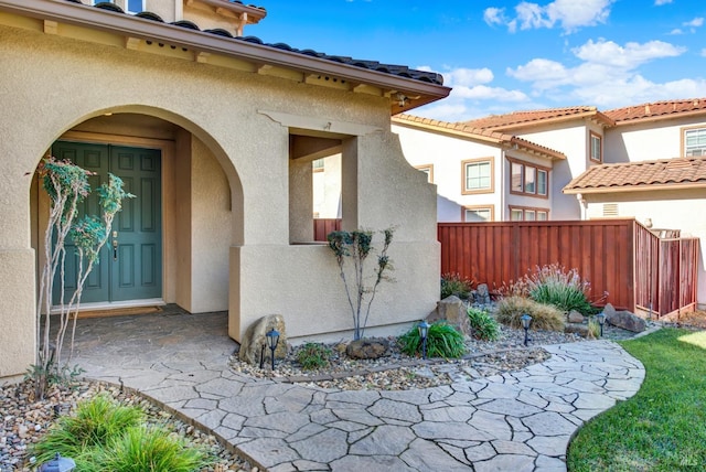 entrance to property with a patio area