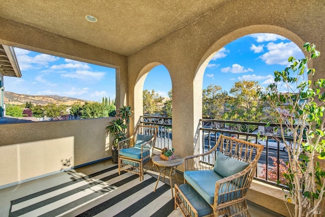 balcony featuring a mountain view