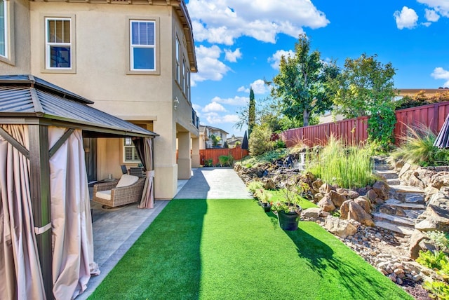 view of yard with a patio area