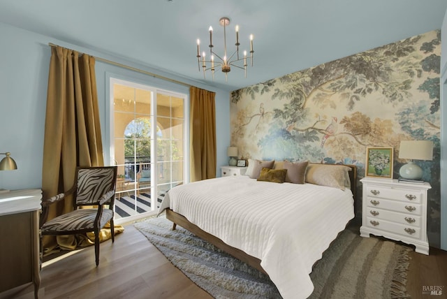 bedroom featuring a chandelier and hardwood / wood-style floors