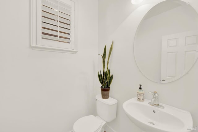 bathroom with toilet and sink