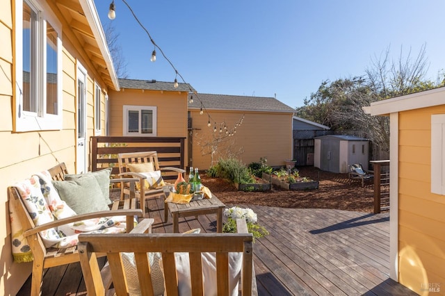 deck with a shed and an outdoor hangout area