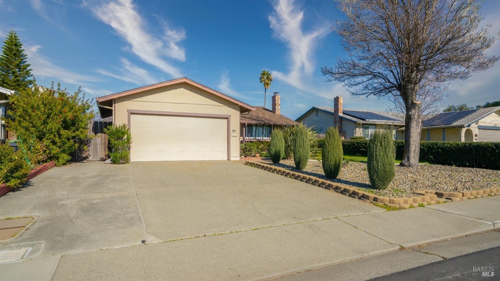 single story home with a garage