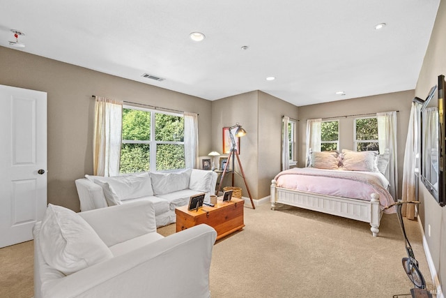 bedroom with light colored carpet