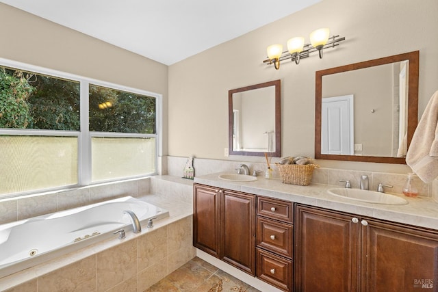 bathroom featuring vanity and a relaxing tiled tub