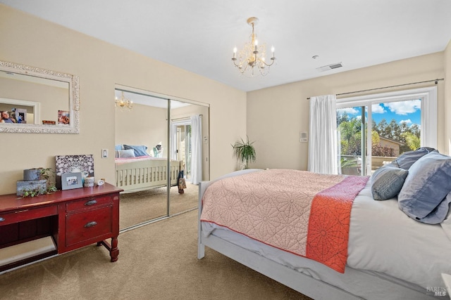 carpeted bedroom featuring a closet and an inviting chandelier