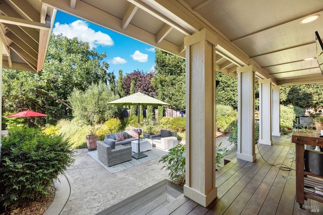 wooden deck featuring an outdoor hangout area