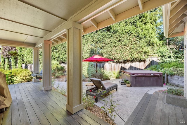 deck featuring a hot tub