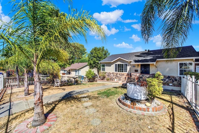 view of front of home with a front yard