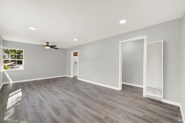 unfurnished room featuring hardwood / wood-style floors and ceiling fan