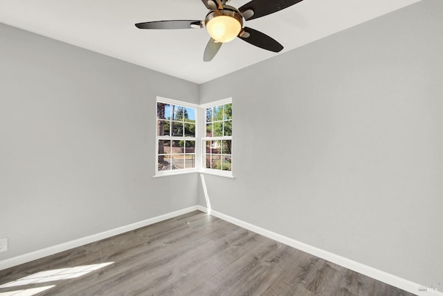 empty room featuring hardwood / wood-style flooring and ceiling fan