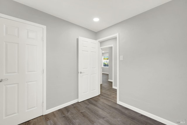 unfurnished bedroom featuring hardwood / wood-style floors