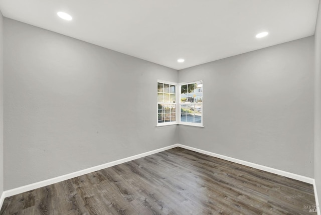 spare room featuring dark hardwood / wood-style floors