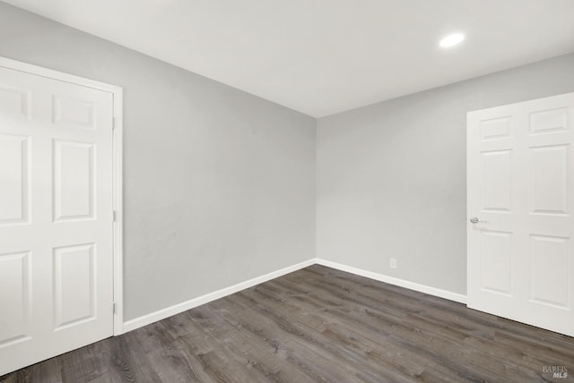 empty room featuring dark hardwood / wood-style floors