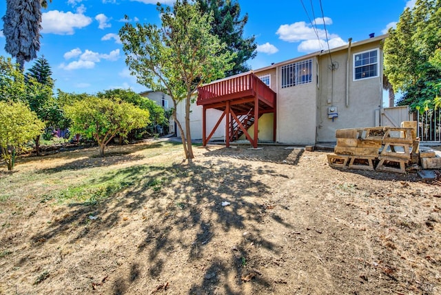 rear view of house with a wooden deck