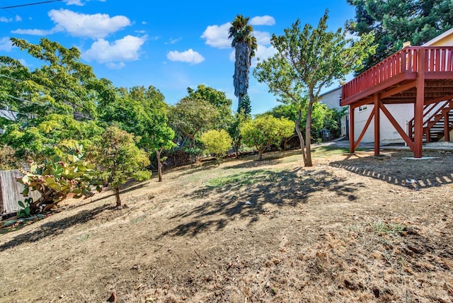 view of yard with a wooden deck