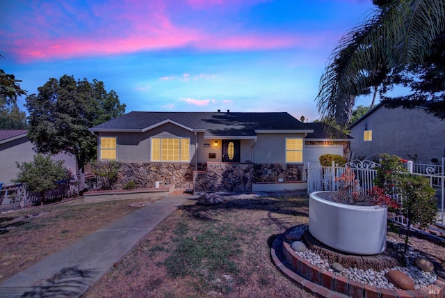 ranch-style house featuring a garage