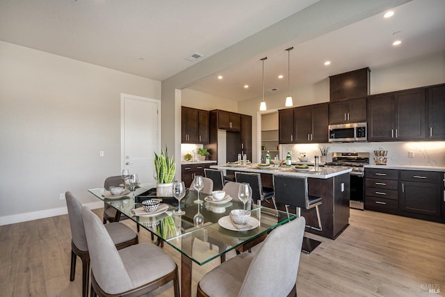 dining space featuring light hardwood / wood-style flooring