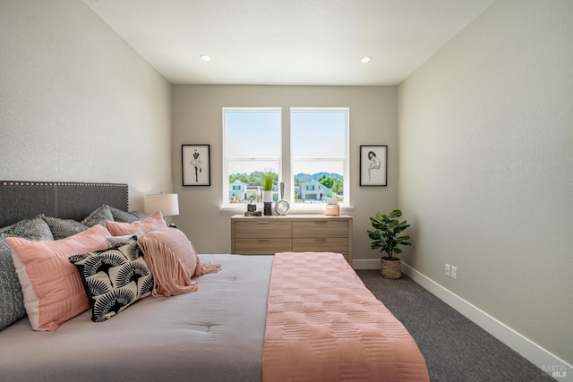 bedroom featuring dark carpet