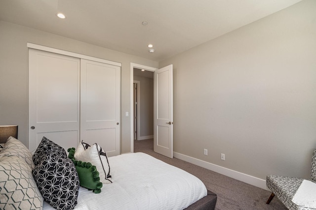 carpeted bedroom featuring a closet