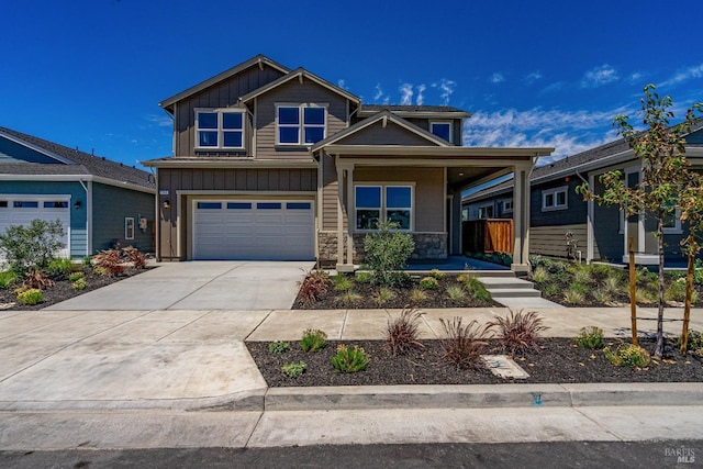 craftsman-style house featuring a garage and a porch