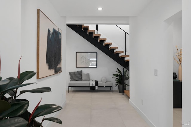interior space with recessed lighting, baseboards, and stairway